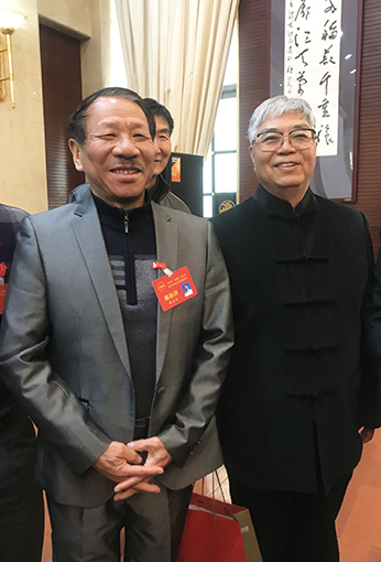 谢老师与中国书法家协会副主席张飚合影.jpg