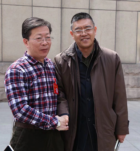 与中国民族建筑研究会杨东升秘书长合影.jpg